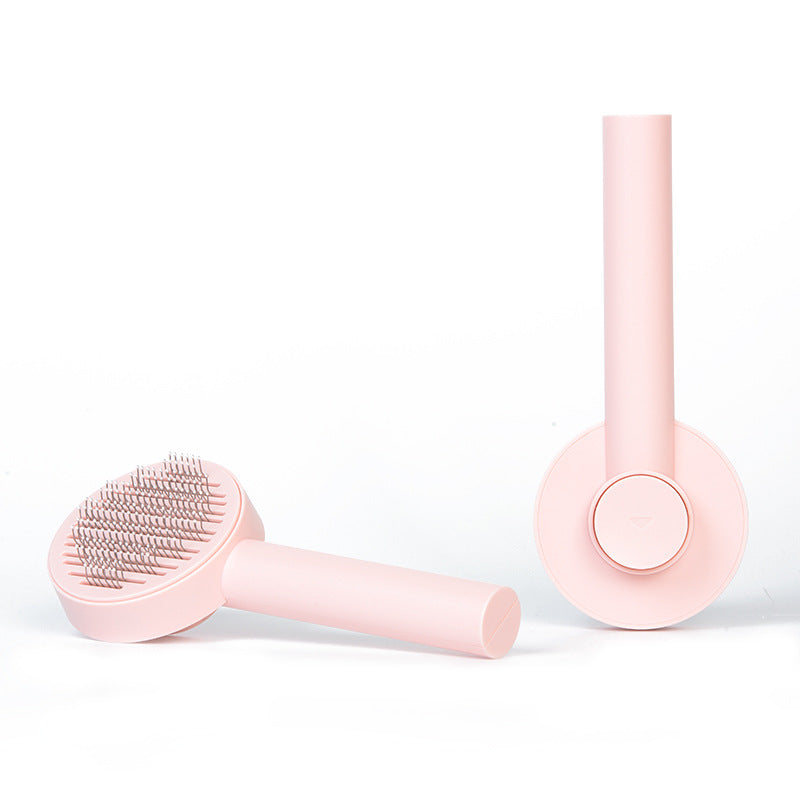 Everyday Ease pink grooming brush: front bristles and back hair-release button; one brush included